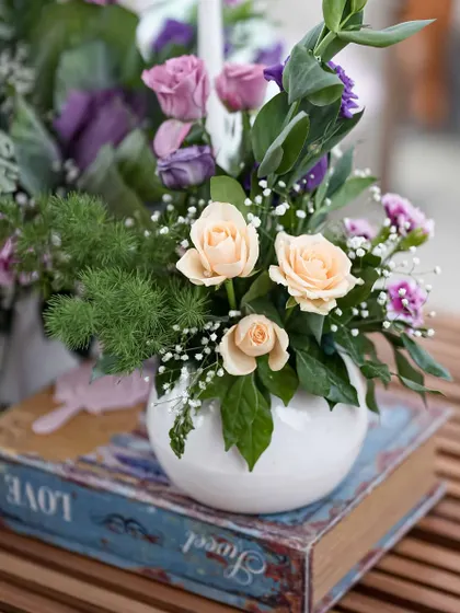 Intimate details from the 'Victorian Bageecha' theme, including vintage books, pastel floral arrangements, and elegant candles.