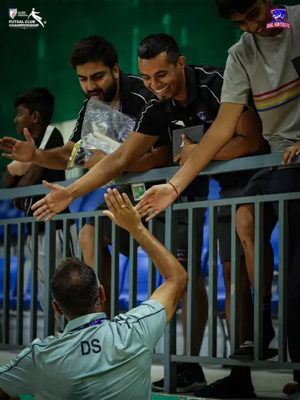 High-fives all around. The team celebrating with the management after the semi-final.