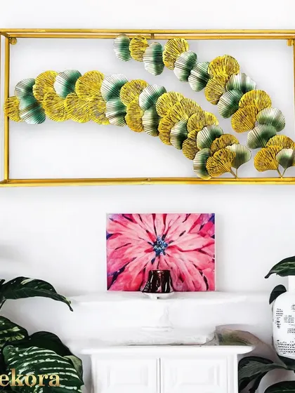 The square frame provides a clean, modern border for the organic shapes of the leaves within.