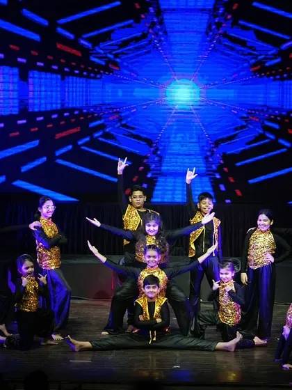 Our kids' freestyle hip hop group in a stunning final pyramid pose, showcasing their flexibility and teamwork.
