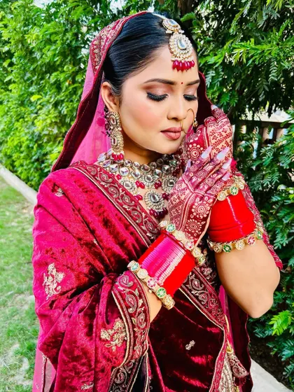 Another angle showing the delicate details of the bridal henna. Notice the fine lines and traditional motifs that extend up the fingers, creating a complete and elegant look.