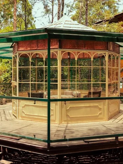 The elegant gazebo-style glasshouse is a unique architectural feature of our Nandi Hills resort.