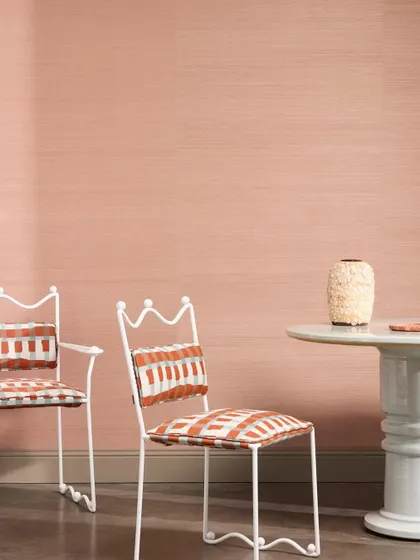 “Abaca” by Nobilis is a refined wallcovering crafted from handwoven plant fibers. Offered in 32 earthy tones, its subtle texture echoes the quiet elegance of nature, as seen here in a soft blush.