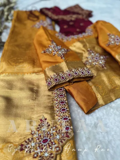 The second blouse for the set, a deep maroon piece with delicate embroidery. This gives the bride an option to change her look for different parts of the wedding.