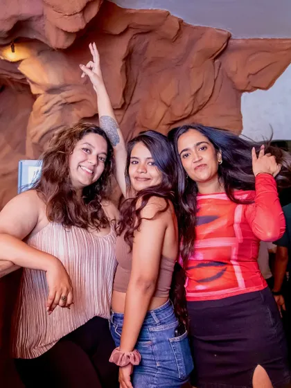 Girls just wanna have fun. A group of friends letting loose and enjoying the music and vibes at our rooftop party.