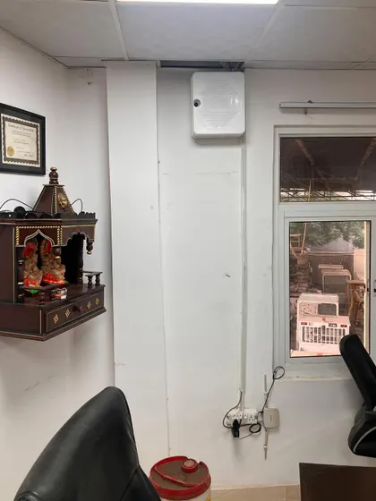 A neat installation of the main junction box in an office, placed high on the wall. All wiring from the cameras leads here, keeping the system organized and secure.
