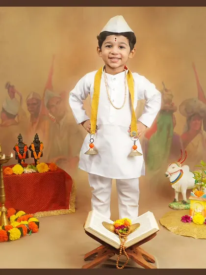 A proud little Varkari standing tall. We love capturing the confidence and joy of children in our themed shoots.