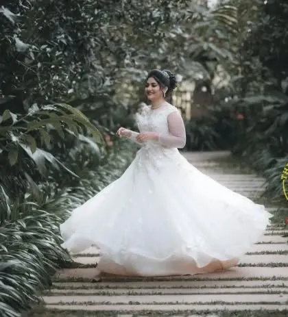 A joyful shot of the bride twirling in her beautiful white gown. I ensure the hair and makeup are secure enough to last through an entire day of shooting and movement.