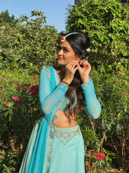 Getting ready for a performance. The details, from the hair to the earrings, are all part of creating the character for the dance.