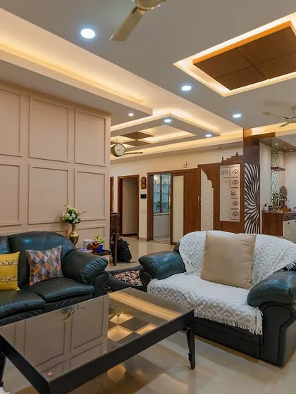 Another angle of the cozy living room, showing the open layout that connects to the dining area and foyer. The design is perfect for a family that values togetherness.