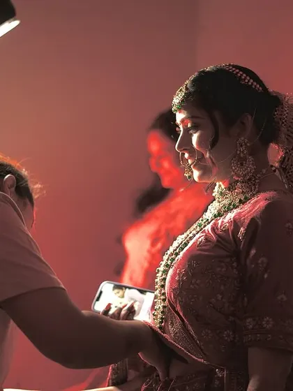 Behind the scenes of a bridal shoot. I always stay close by for touch-ups to make sure my bride looks perfect from every angle.