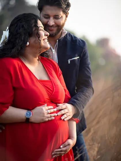 A joyful, natural laugh shared between partners. I love capturing these unposed moments that show the true happiness and excitement of the journey to parenthood.