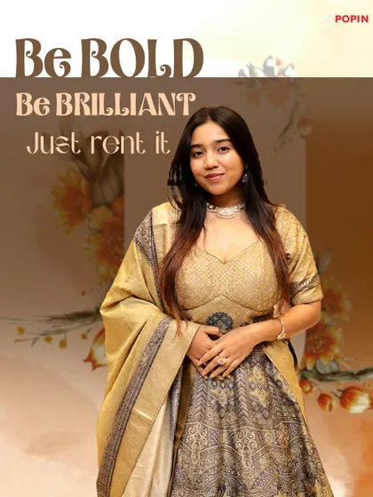 Be bold, be brilliant, just rent it. This graphic features a golden and grey printed lehenga, perfect for a sophisticated look.