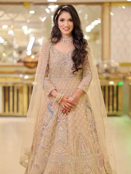 A poised and elegant portrait of the bride in her beautiful engagement outfit.