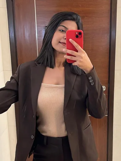 A quick selfie before heading to host the BFSI Excellence Awards. The brown blazer and neutral top combination is a classic, professional look for a daytime conference.