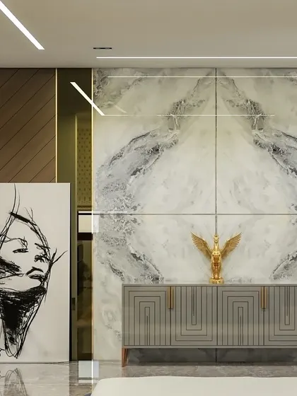 Making a statement with elegance. This foyer design features a stunning statuario marble wall, a modern grey console, and bold abstract art to create a luxurious and dramatic first impression.