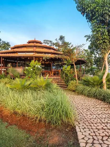 Another beautiful shot of the pathway and dining hall at Kabini, showcasing our commitment to creating harmonious natural spaces.