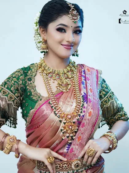 A radiant bridal look with fresh jasmine flowers in the hair, a classic element of South Indian weddings.