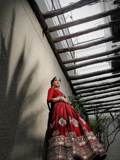 The same powerful low-angle shot, emphasizing the grandeur of the traditional bridal attire.