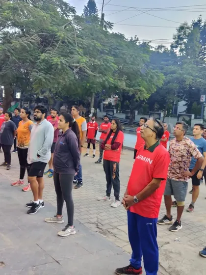 An engaged group of runners listening intently during a Garmin Run Club workshop. These sessions are a great way to share knowledge and build a stronger running community.