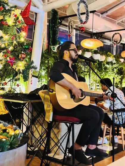 Performing at a Christmas event. I can adapt my setlist and vibe for any occasion, including festive holiday parties, creating a warm and cheerful atmosphere.