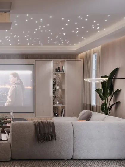 This view shows the projector screen and the custom cabinetry designed to discreetly house AV equipment.