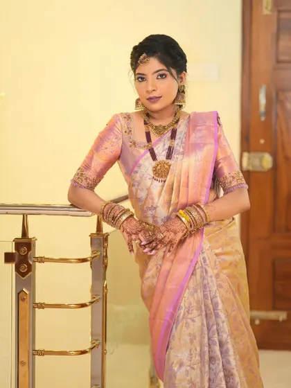 My client Harshitha looking beautiful in a lavender and gold saree for her housewarming ceremony.