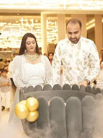 The baby's grand entrance in a beautiful, modern cradle, complete with a magical dry ice effect.