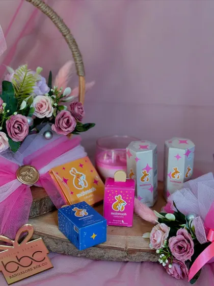 The full hamper featuring Mishmash Naturals products, presented in a lovely basket with floral arrangements.