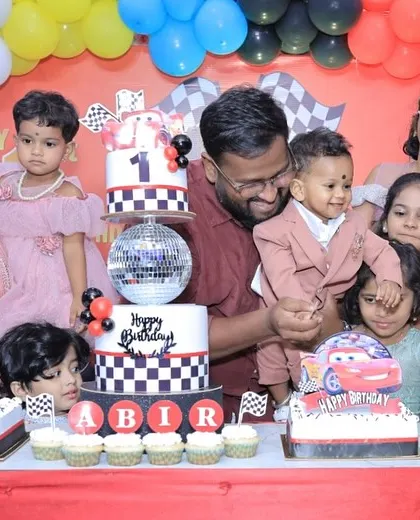 Another wonderful family moment from Abir's birthday, with all the kids gathered around the amazing cake setup.