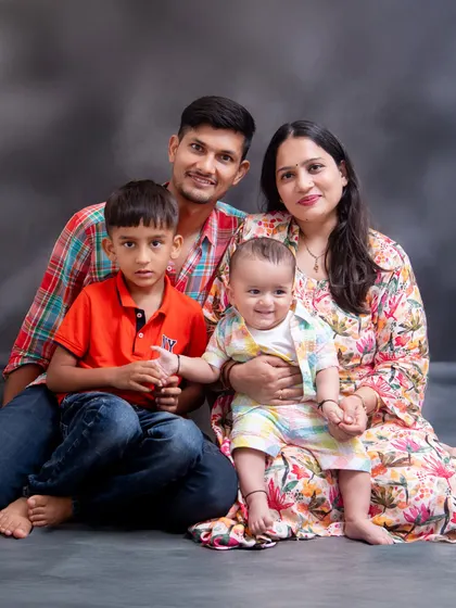 A casual and colorful family photo. We help with styling to ensure your outfits complement each other and the overall feel of the portrait.