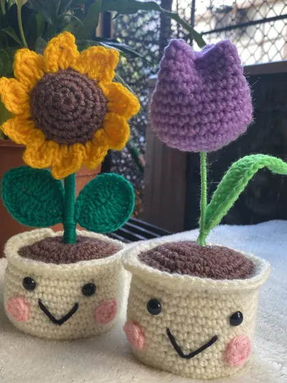 Another shot of this adorable duo. The contrast between the bright yellow sunflower and the deep purple tulip is just lovely.