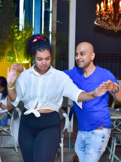 A close and connected dance with a happy expression.