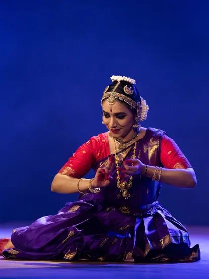 A seated pose from Meera Krishna's recital, her hands and face conveying the narrative of the piece.