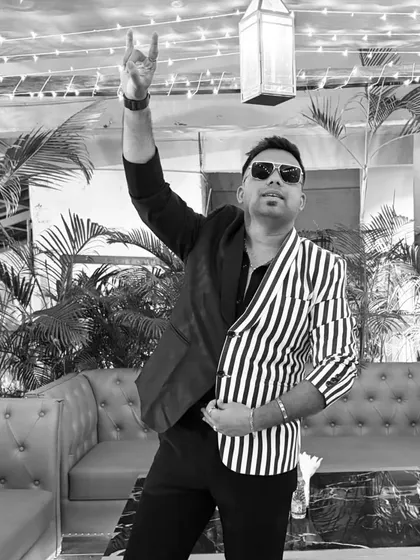 A black and white shot of my two-toned blazer. The contrast is striking and adds a modern, edgy vibe to my host persona.