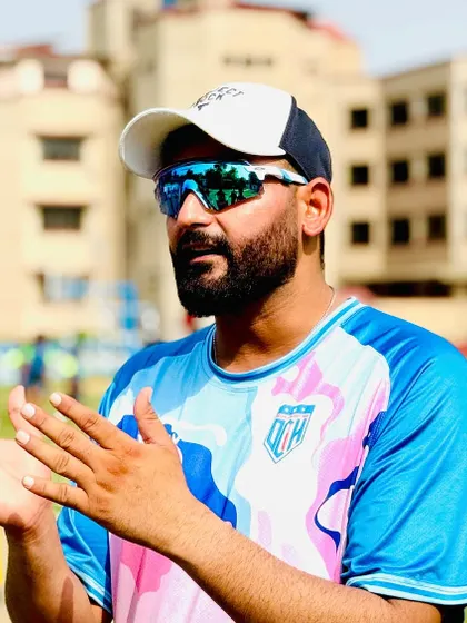 In discussion with players during the camp. Communication and clear instructions are key to effective coaching.