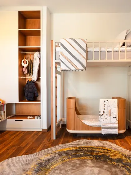 The finished children's room, brought to life from the render. This comparison highlights our commitment to executing a design vision with precision, from the custom bunk bed to the whimsical world map on the wall.
