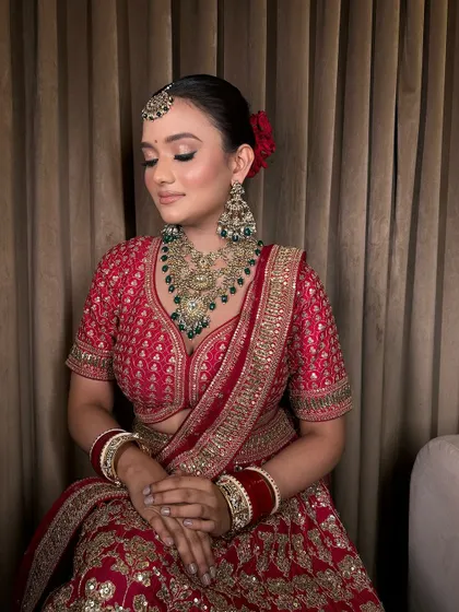A moment of quiet contemplation for the bride, looking absolutely stunning in her traditional attire and jewellery.