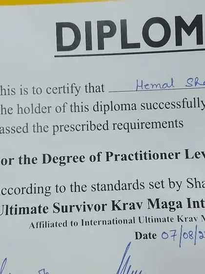 My diploma for Krav Maga Practitioner Level F-5, showing progression through the system.