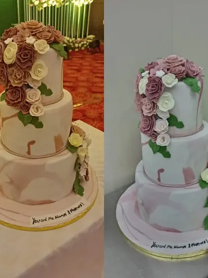 A magnificent three-tiered wedding cake with a marble effect and cascading sugar flowers in shades of mauve and white. This cake is a true statement piece for a grand reception.