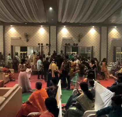 A view of the wedding hall, with guests starting to gather on the dance floor.