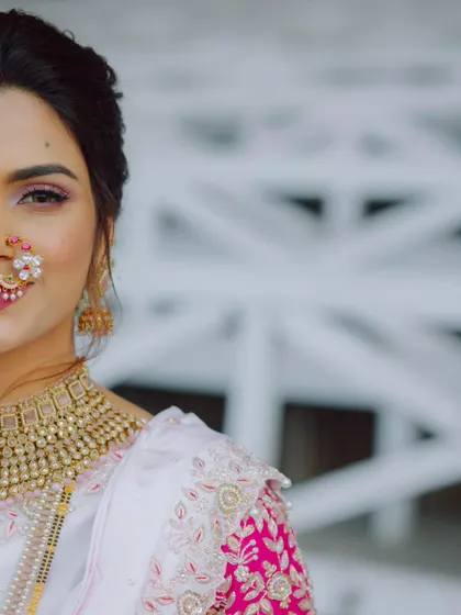 A stunning close-up portrait of a Maharashtrian bride, focusing on her traditional nath and beautiful makeup.