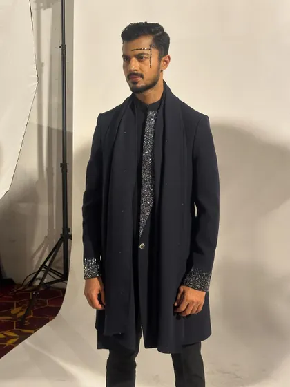 Backstage at Mysore Fashion Week, getting ready to walk for Pankaj Soni in a layered, dark ethnic ensemble.