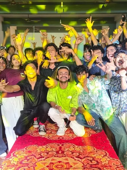 A final pack-up photo with the core group of students after a successful show at MH College.