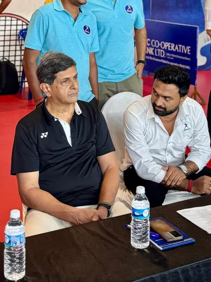 Prakash Padukone in discussion with an official during a sub-junior ranking tournament. His hands-on involvement ensures the quality and integrity of the competition.