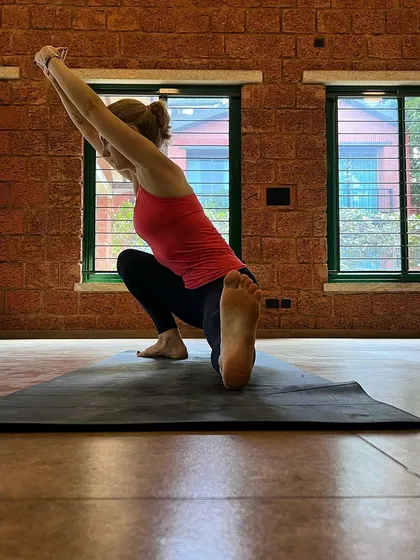 As your practice advances, let the ego recede. Poses like this variation of Skandasana are tools for self-awareness, where the inner journey is more important than outward perfection.