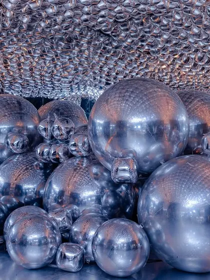 A futuristic and immersive photo-op I designed, featuring a cave of silver spheres that created incredible reflections and a sense of wonder.