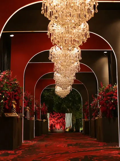 We believe the first impression is the last. This dramatic arched entryway, designed for a 'Red Royal Affair' cocktail night, promises a journey into an evening of unparalleled luxury and passion. ❤️