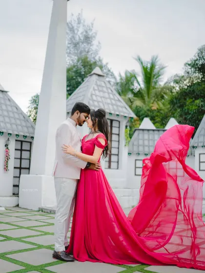 A fairytale setting for a fairytale couple. The vibrant pink trail gown adds a beautiful splash of color and movement, making their pre-wedding photos even more magical.