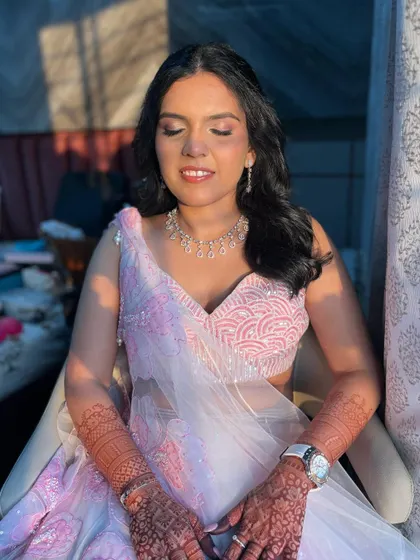A close-up of the makeup, showing the soft pink eyeshadow and the overall dewy finish.